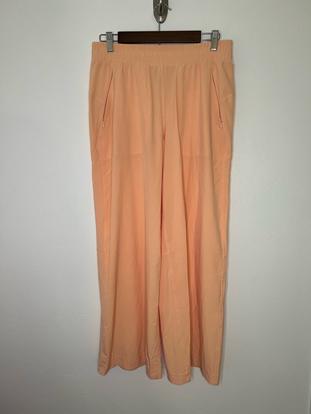 Lululemon Swift Mid-Rise Wide-Leg pants in the color Peach Bellini